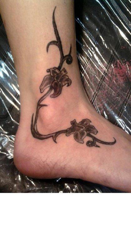 Bad Tattoos - Flowers and barb wire?